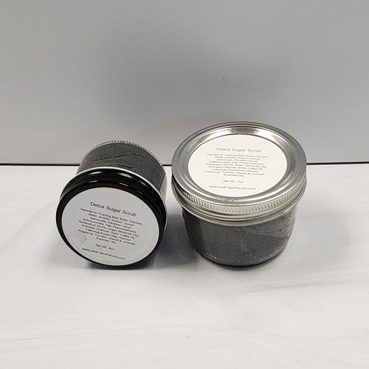 Both sizes of our detox sugar scrub in glass jars.