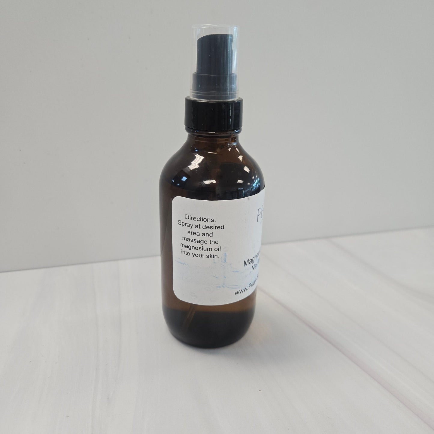 4oz glass amber bottle of magnesium spray